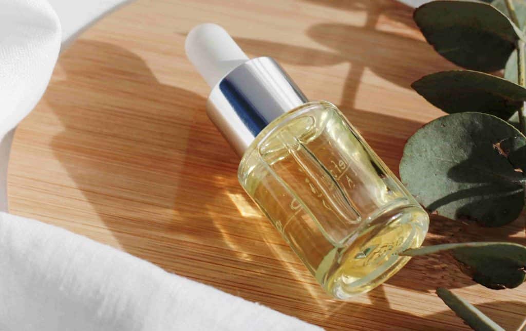 a bottle of cosmetic product on a wooden table-cosmetics product labeling europe