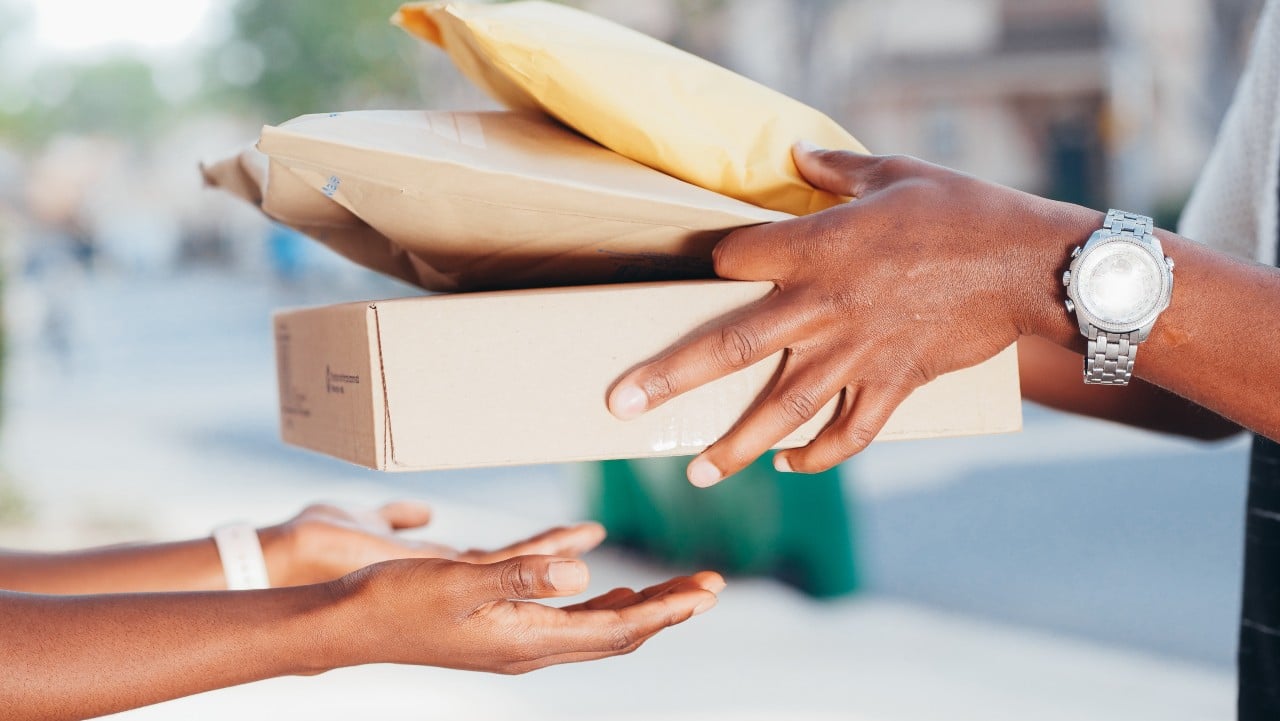 image of two pair of hands exchanging packages-extended producer responsibility epr