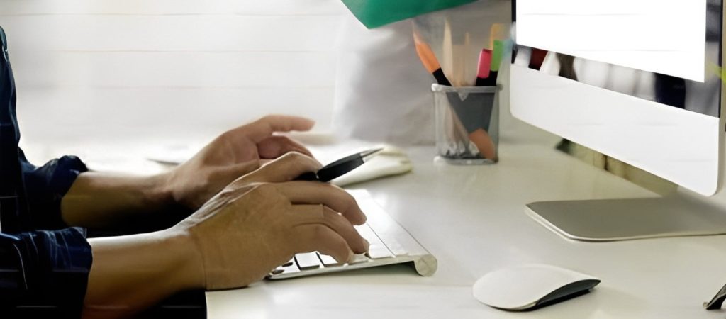 man working at a keyboard-cosmetics packaging regulations Europe