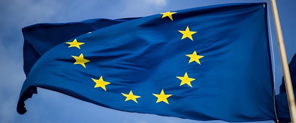 european union flag blowing in the wind - regulatory inspection for cosmetic products