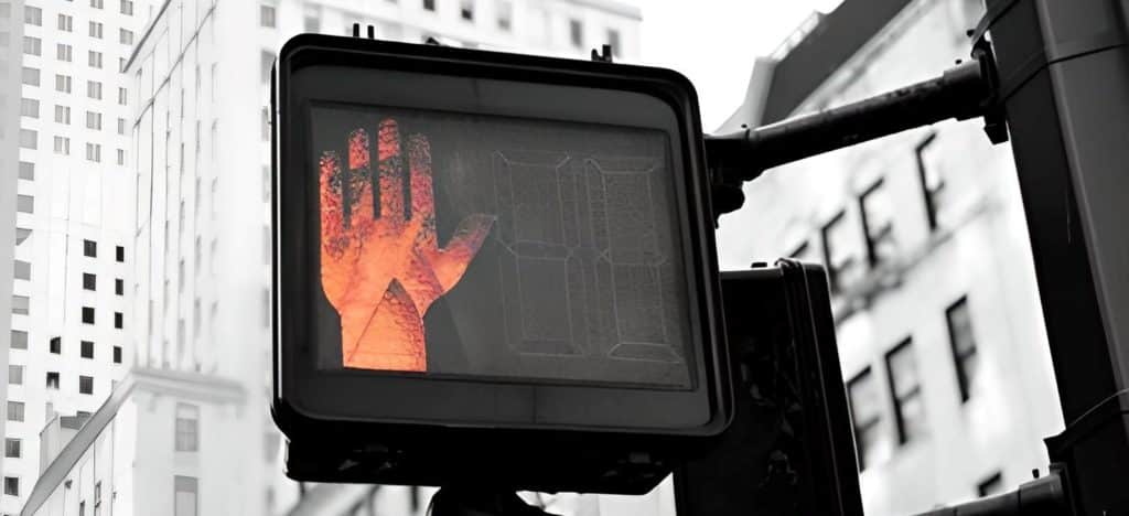 image of a traffic light with the stop hand sign -  eu authorities inspection process cosmetics
