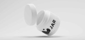 white plastic jar on a grey background - Requirements for Packaging and Plastic Tax in Spain