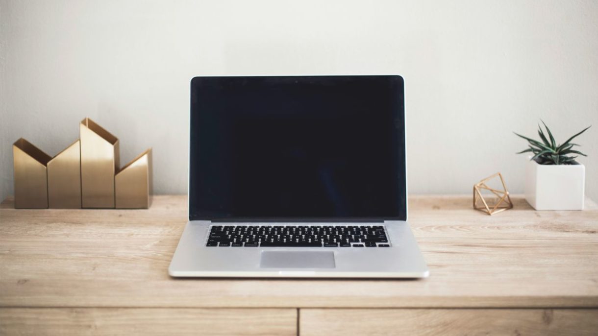 a laptop on a desk - Cosmetic Product Notification Portal