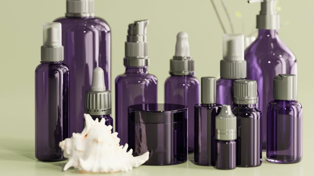 purple cosmetic product bottles of various sizes