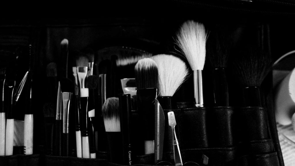 black and white image of make up brushes