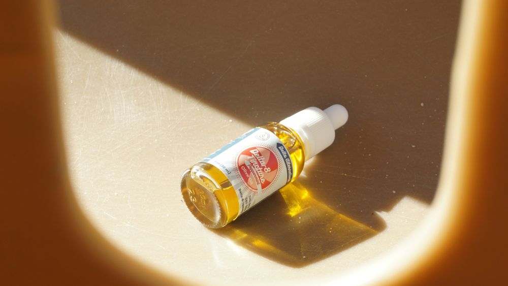 a small bottle of cosmetic product containing japanese anti-ageing oil