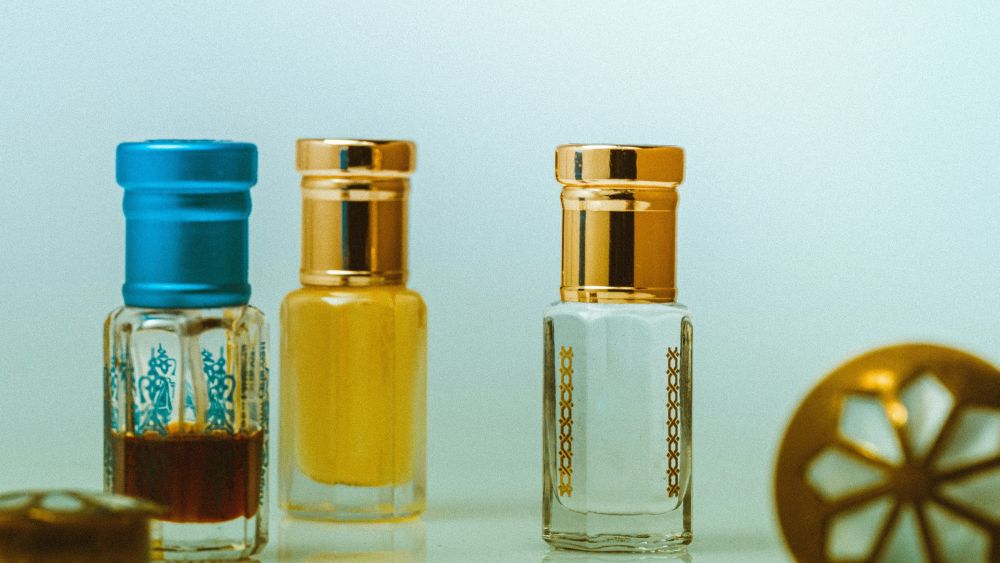 three sample cosmetic bottles on a table