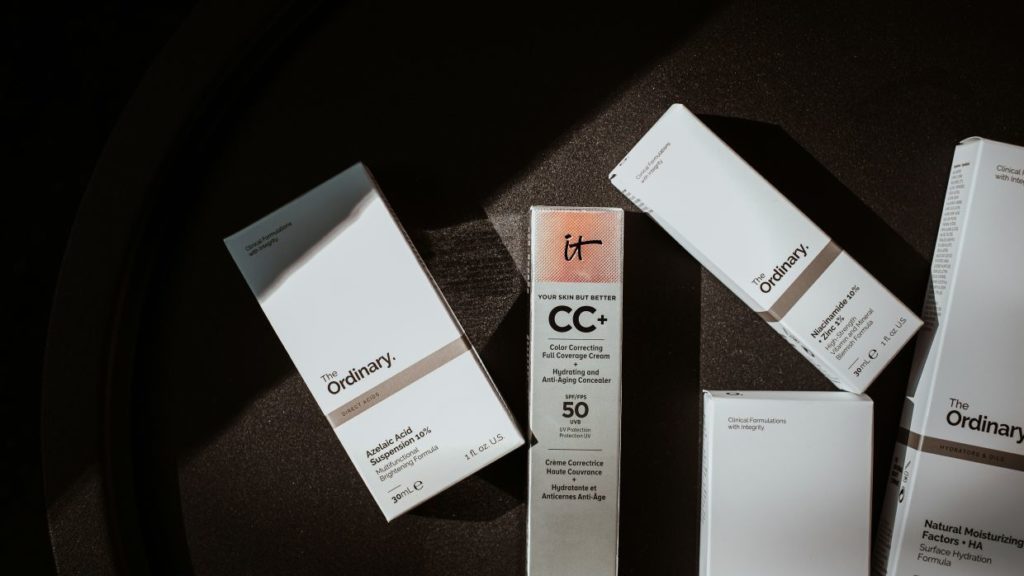 packages of cosmetic products on a black surface