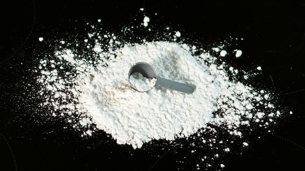 Image of a lump of white powder on a black surface