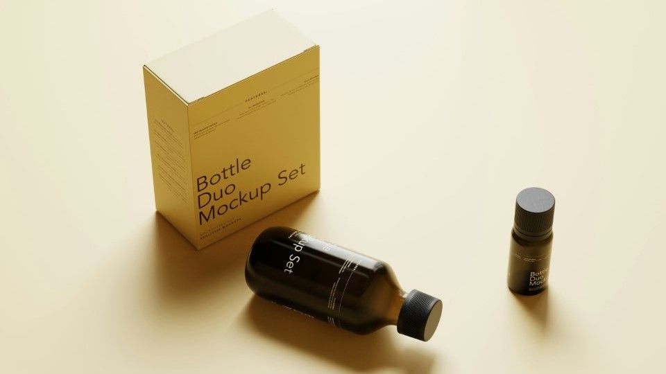 a small bottle of cosmetic product next to a packaging box