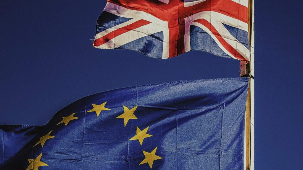 close-up of the eu and uk flags blowing in the wind