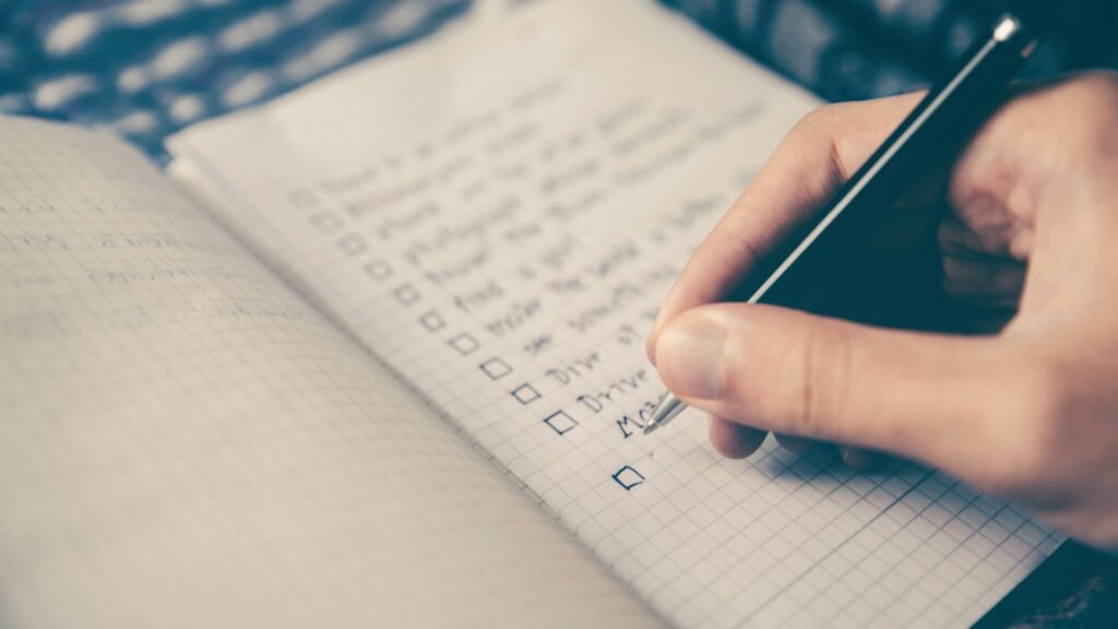 close-up image of a person writing a cosmetic product safety report