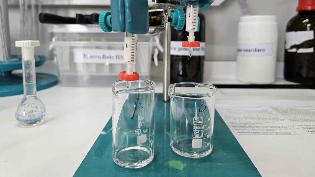 A laboratory table with two glasses filled with a transparent liquid