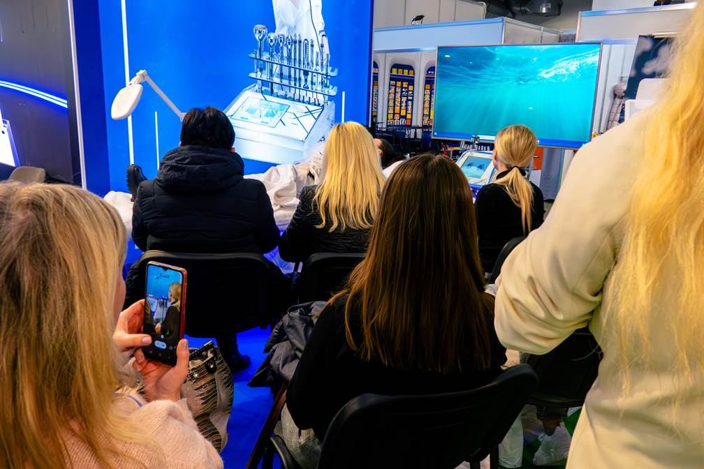 People gathered for a demo at the in-cosmetics global trade show in Europe