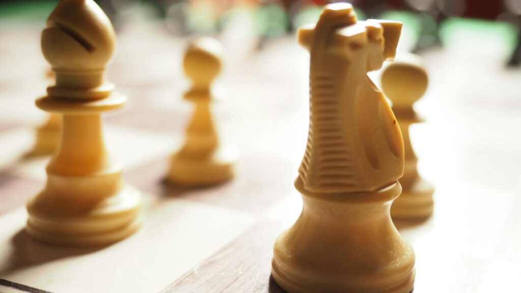 close-up of chess pieces on a chess board